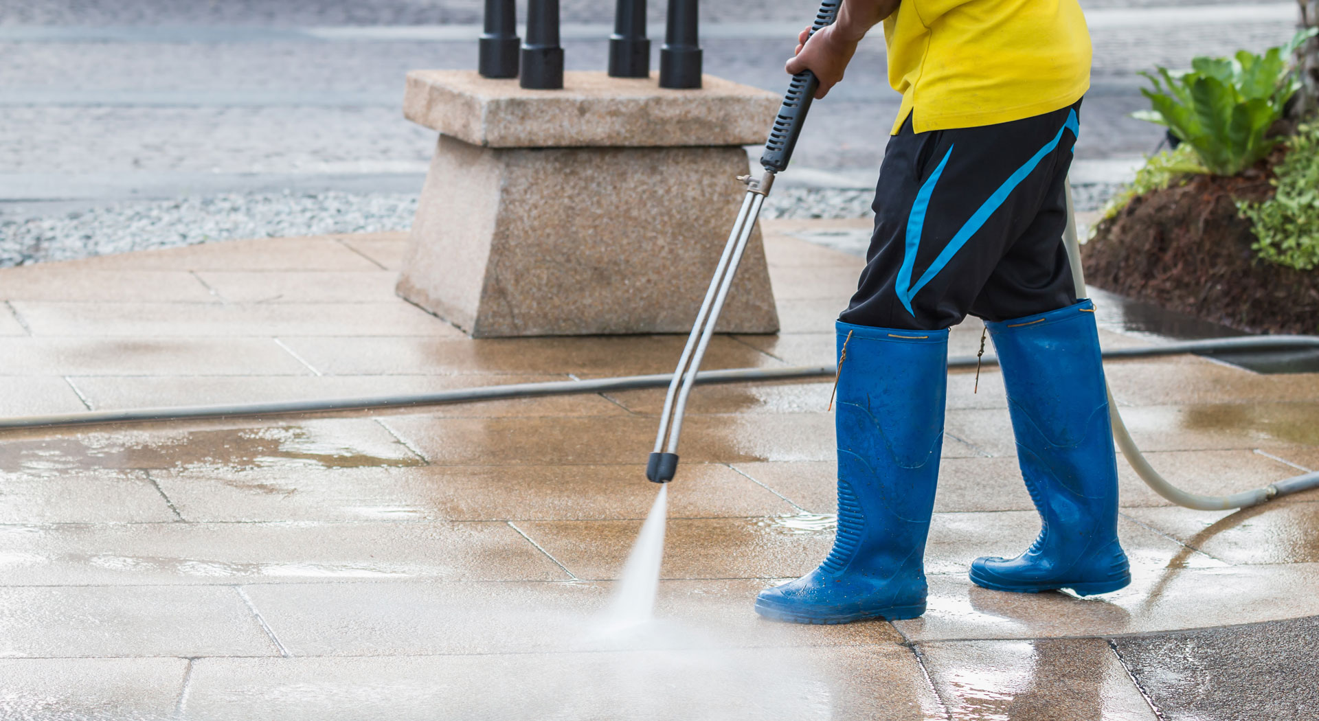 photo of cleaning the sidewalks with a pressure washer